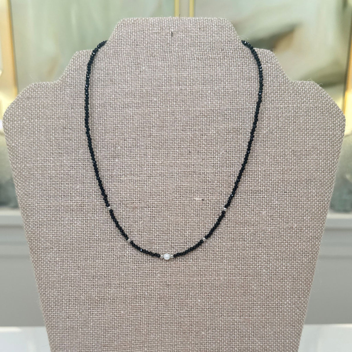 Black Beaded Necklace with Pearl Accents, close-up of faceted black beads and pearl accents