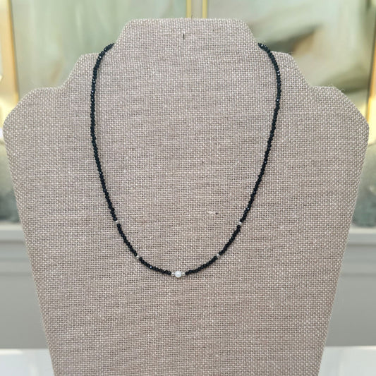Black Beaded Necklace with Pearl Accents, close-up of faceted black beads and pearl accents