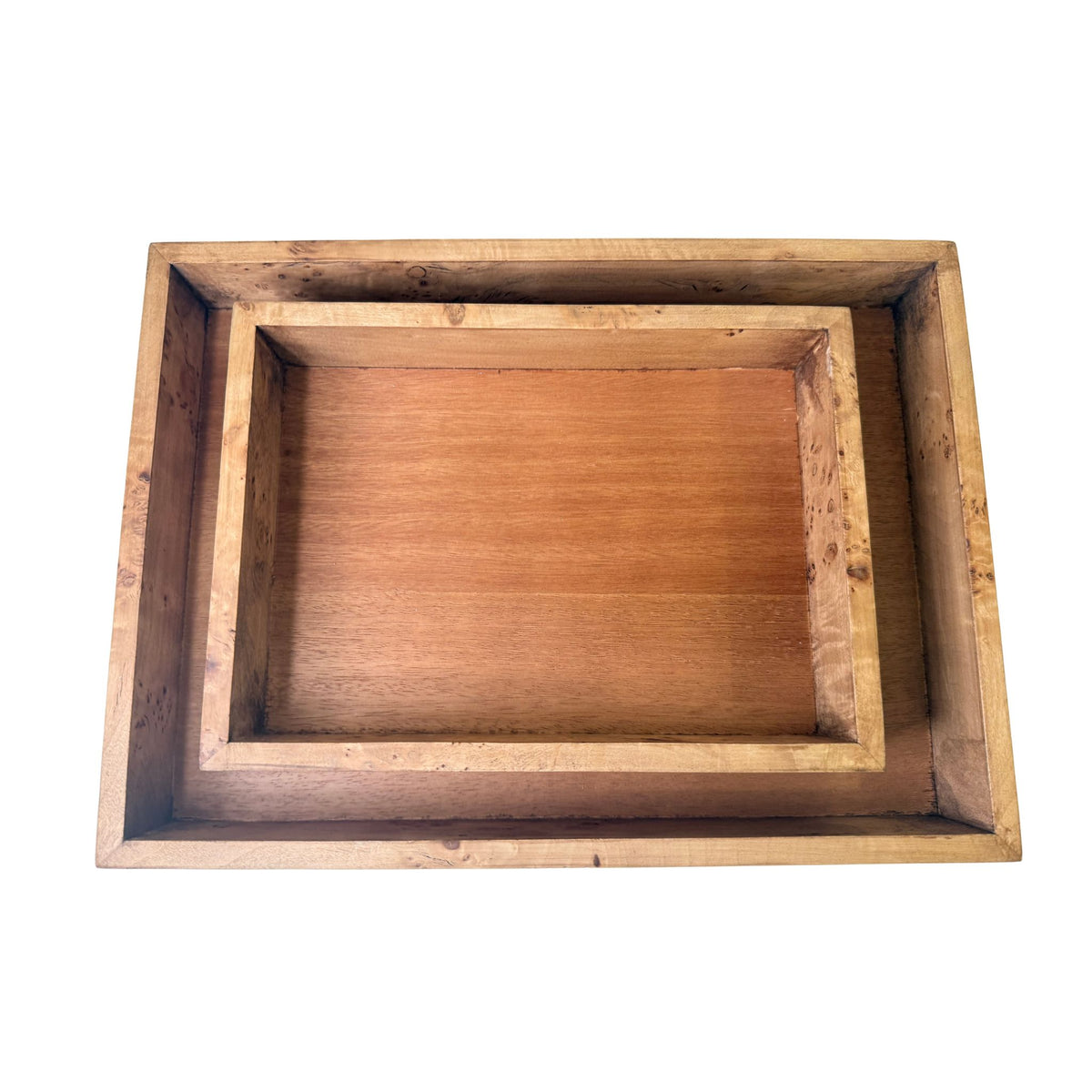 Close-up corner view of a rectangular wood tray with a mahogany-tone interior and a natural burl-wood border.