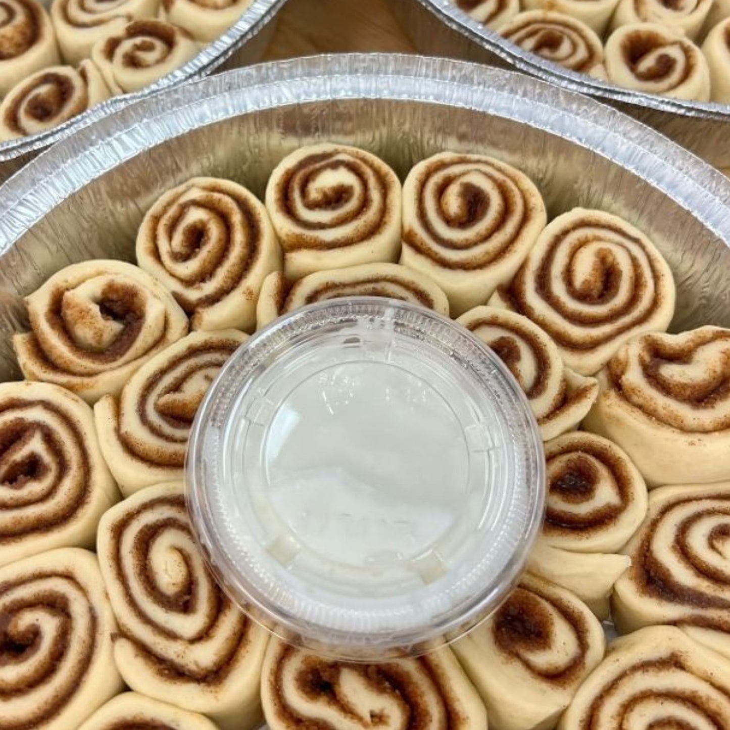 Frozen mini cinnamon rolls in packaging, ready to bake