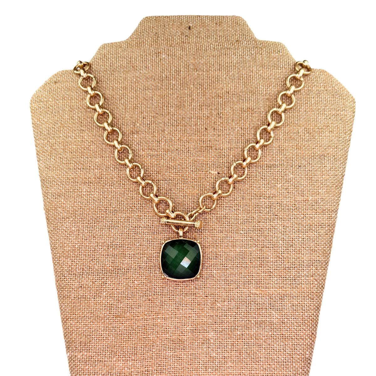 Gold toggle necklace with stone pendant, styled shot