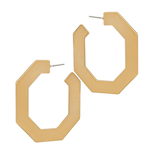 A pair of chunky, open geometric hoop earrings in a matte gold finish, displayed on a clean white background.