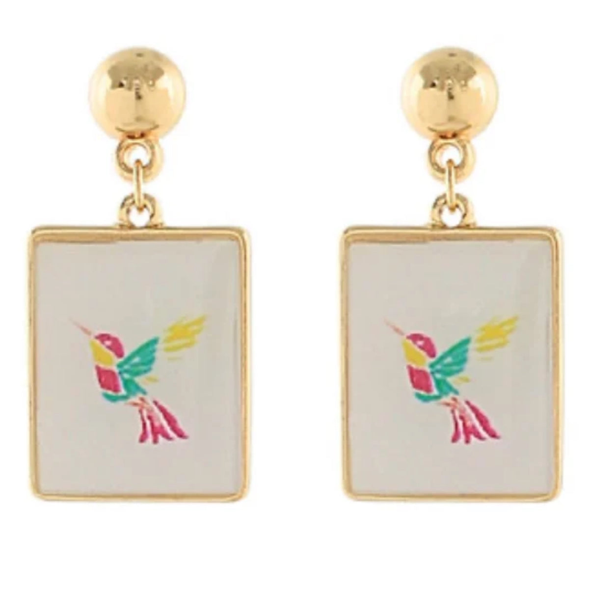 A pair of gold-tone drop earrings with gold-framed white tiles, each printed with a colorful hummingbird in pink, teal, and yellow.