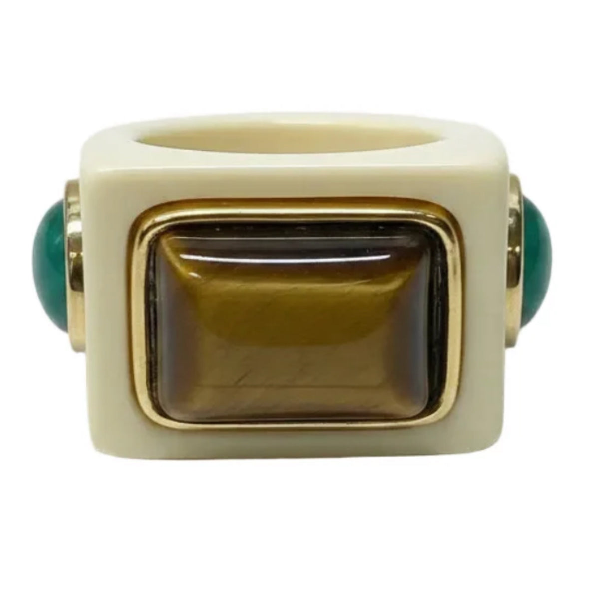 Ivory Swiss resin ring with a rectangular tiger eye stone in a gold-tone bezel, flanked by two small green stone accents.