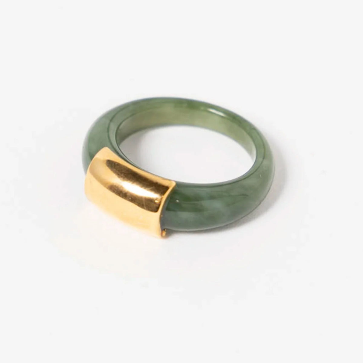 Jade-green Swiss resin ring with a wide polished gold-tone accent panel.