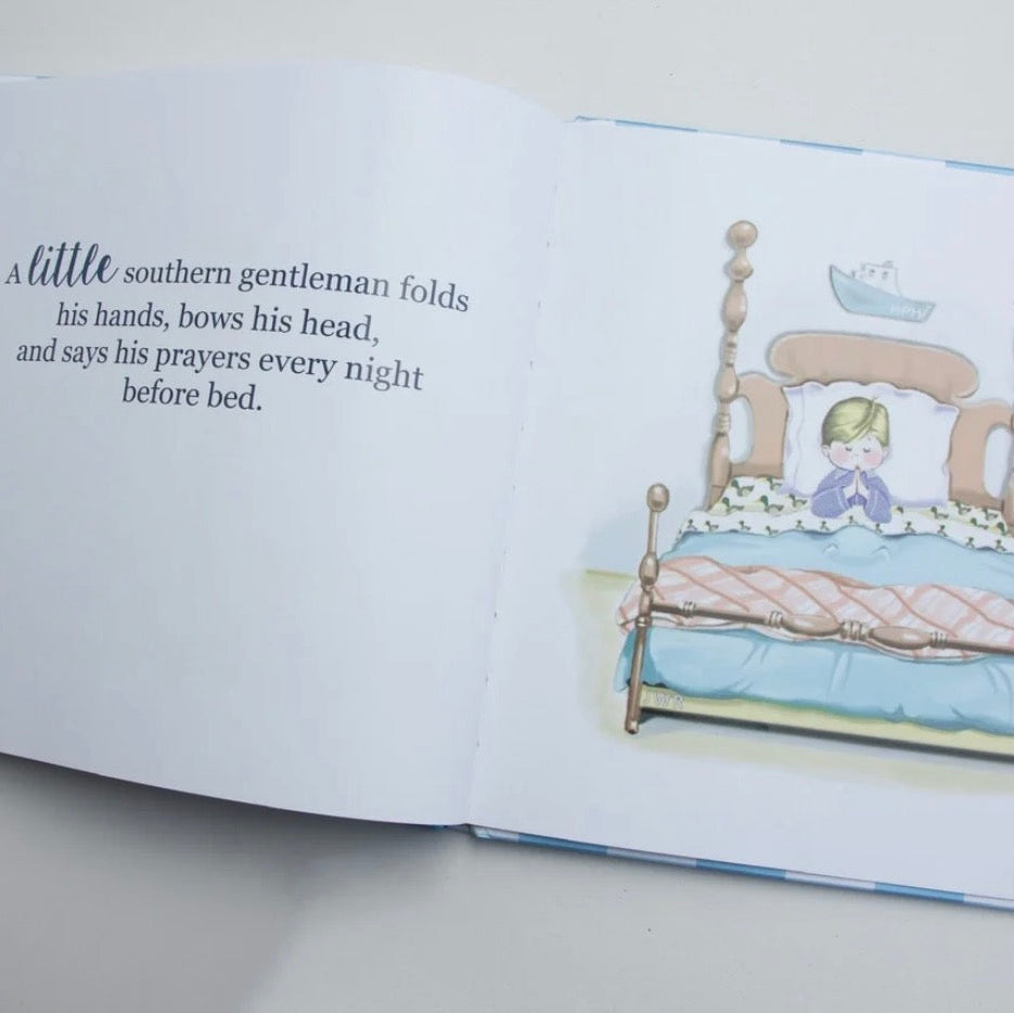 An open children's picture book showing a printed story on the left page and a watercolor illustration of a child in bed on the right page, photographed on a light surface.