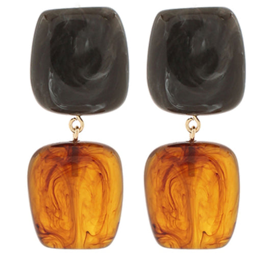 Marbled resin dangle earrings with a charcoal gray square on top and an amber tortoise square below.