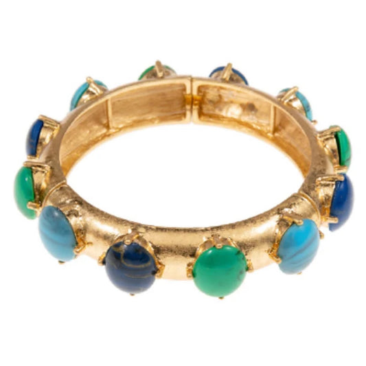 A gold-tone bangle bracelet studded with oval cabochon stones in turquoise, green, and navy blue.