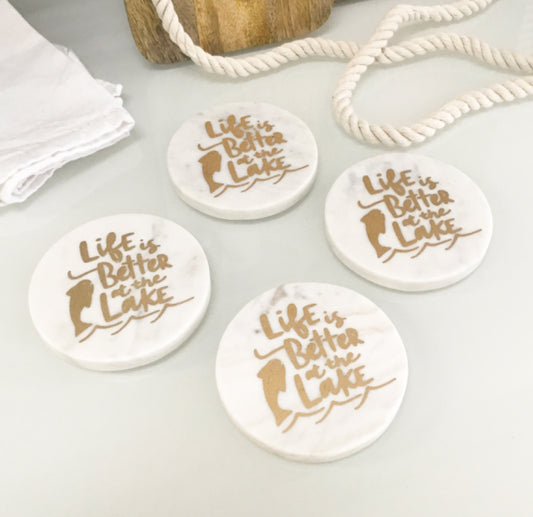 Set of coasters with a cheerful "Life is Better at the Lake" motif