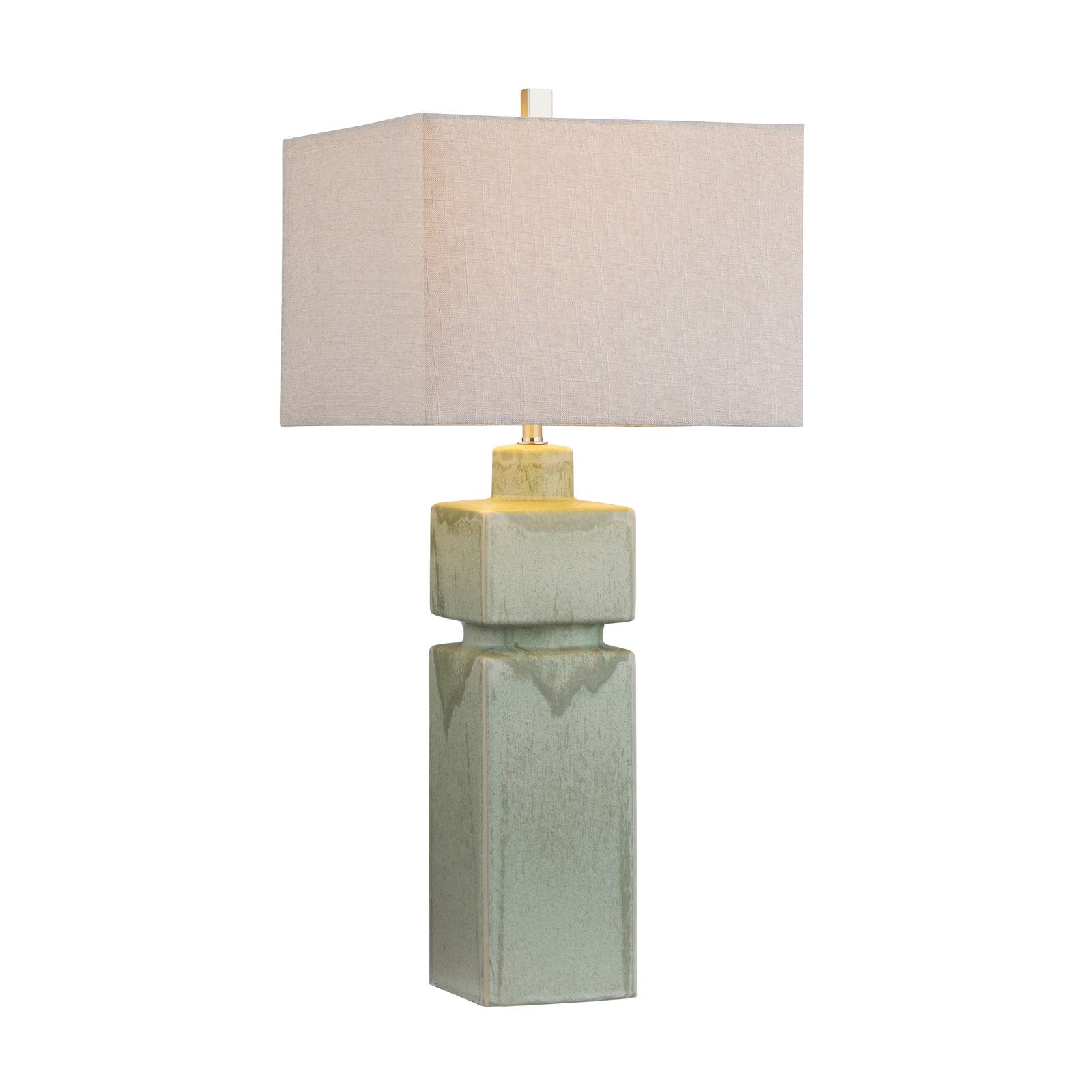 Table lamp with a textured green base and beige lampshade on a white background