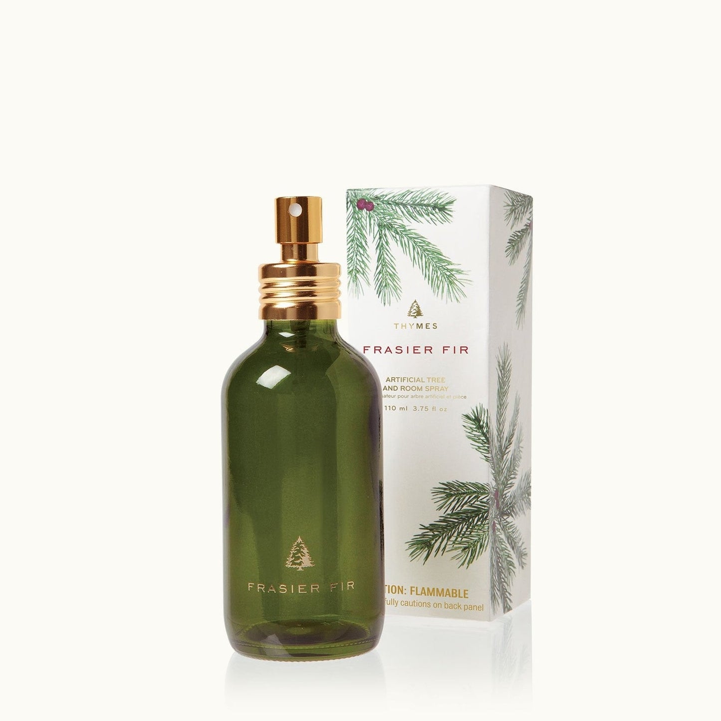 Green Frasier fir spray bottle with gold nozzle and matching box on a white background.