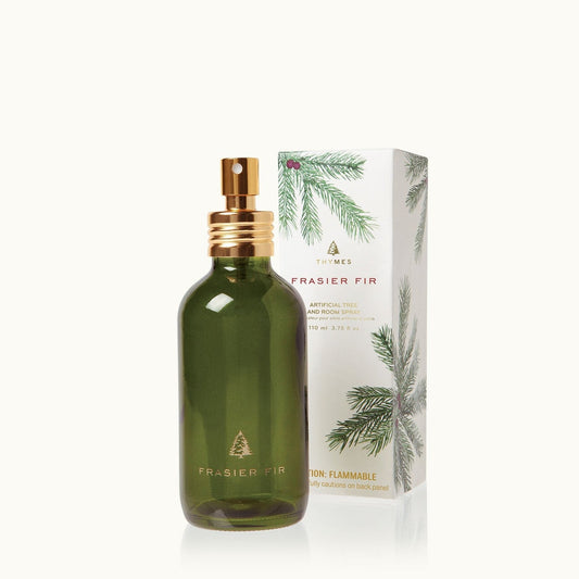 Green Frasier fir spray bottle with gold nozzle and matching box on a white background.