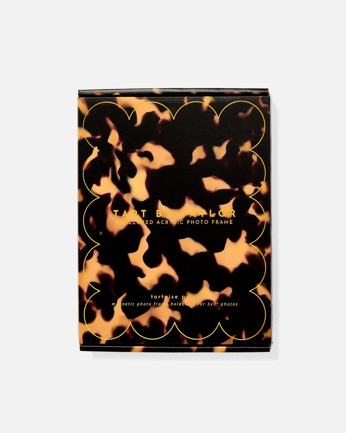Tortoiseshell scalloped acrylic photo frame, styled on a shelf
