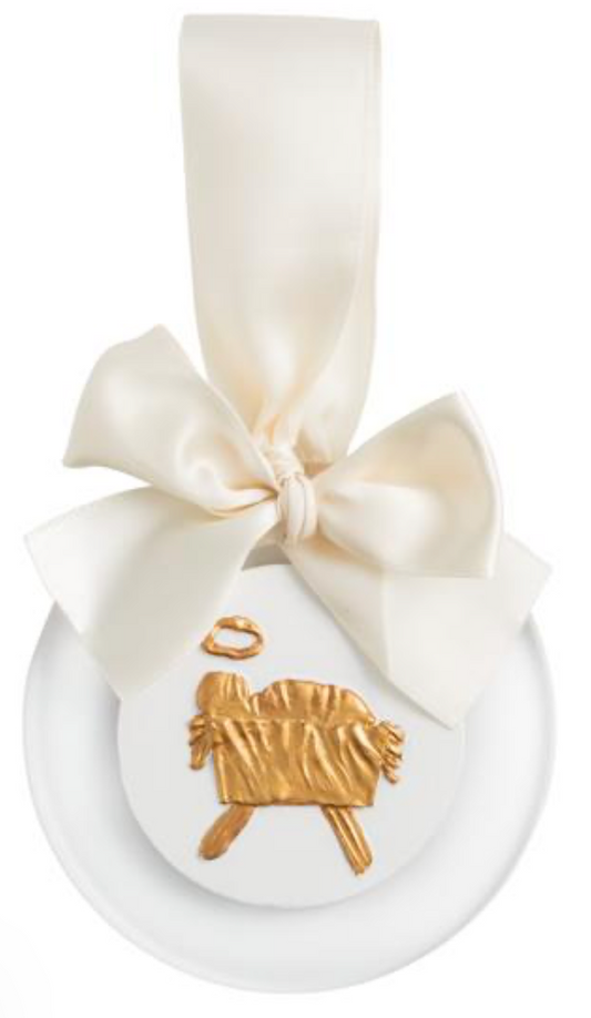 White ceramic round ornament with a cream ribbon bow and a gold lamb charm