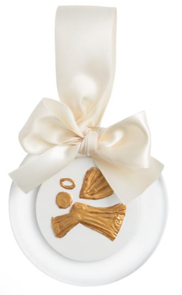 White ceramic round ornament with a cream ribbon bow and a gold bone charm